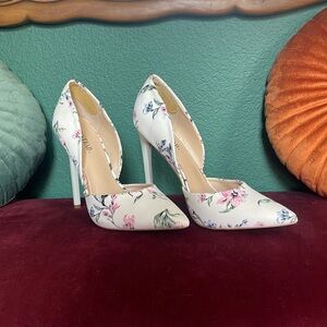 White floral pumps